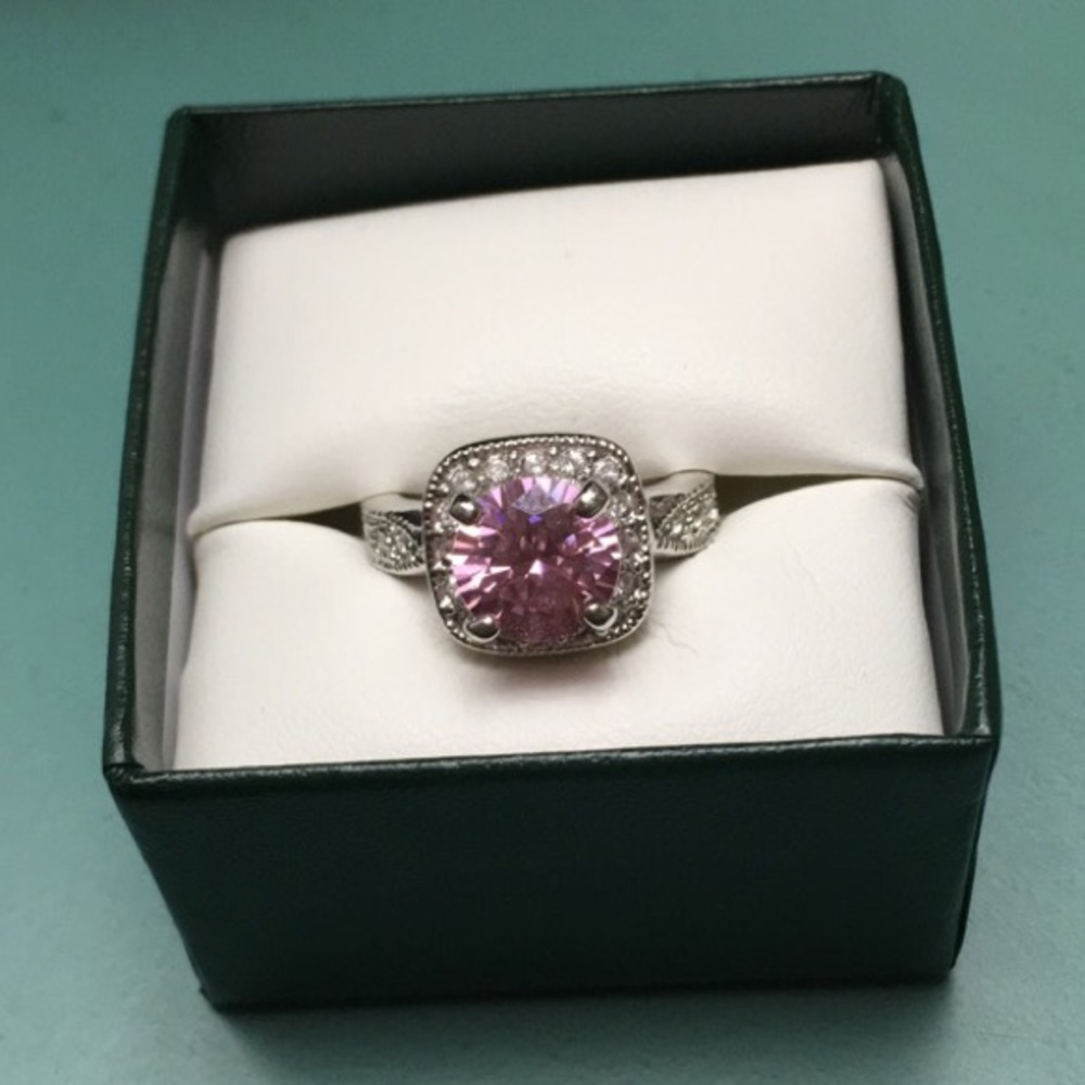 Pink and clear stone ring.